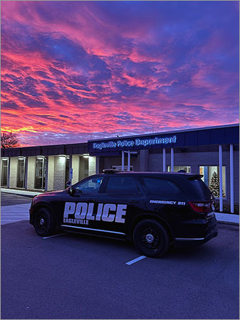 Eagleville Police Department Patrol Car with Building and Sunset in Background